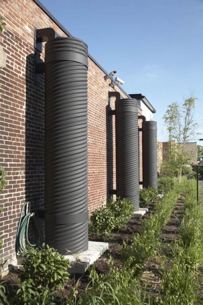 Three rainwater collection tanks can store 240 cubic feet of runoff that's reused reused for landscape irrigation. (Ted Wathen/Quadrant)