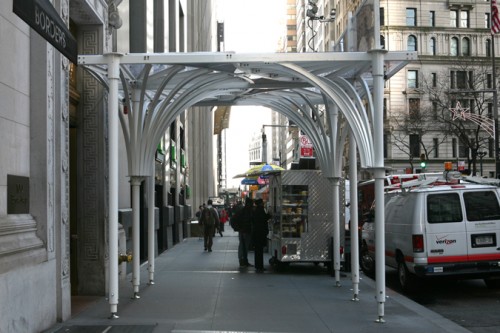 As seen from sidewalk approach the new umbrella shed allows for clear sight lines down Broadway.
