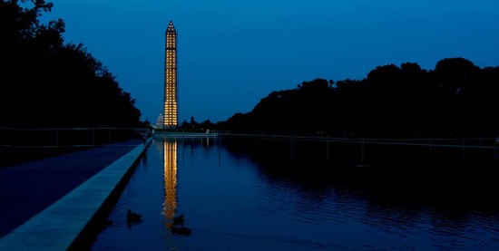 A scaffolded Washington Monument at night. (Victoria Pickering / Flickr)