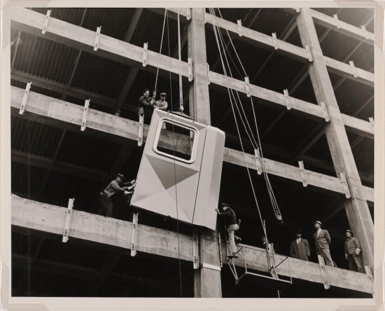 Newman-Schmidt Studios: Workmen installing the first aluminum panel, 1951 (Courtesy Director’s Discretionary Fund) 