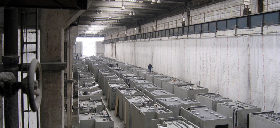 Prefab concrete bathroom pods at a factory in Poland. The high cost of manufacturing in New York is driving away many modular construction firms. (seier+seier / Flickr)
