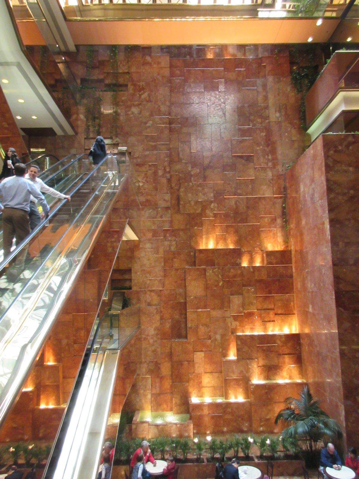 Paul Goldberger once praised the escalator- and waterfall-lined atrium of the Trump Tower. Inside the atrium are several eateries, including the Trump Bar, Trump Grill, Trump Cafe, and Trump’s Ice Cream Parlor. (William Menking)
