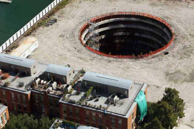 Aerial photo of a deep, dark hole in a construction site