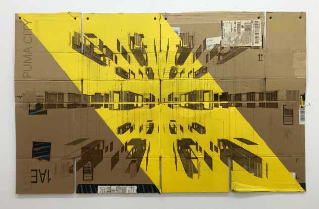 Foldable #1. 2016. Laser-cut upcycled, folded cardboard boxes, sprayed acrylic, grommets, yellow string, acid free glue, and artist’s metal hanging pins mounted on wood and metal frame. Titled, signed and dated verso. 44 x 28 inches. (Courtesy the artists and Alden Projects)