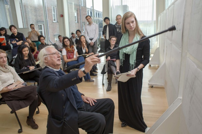 Richard Meier visits a studio to discuss an assignment students interpreted the architect's designs in drawings. (Courtesy Cornell University)