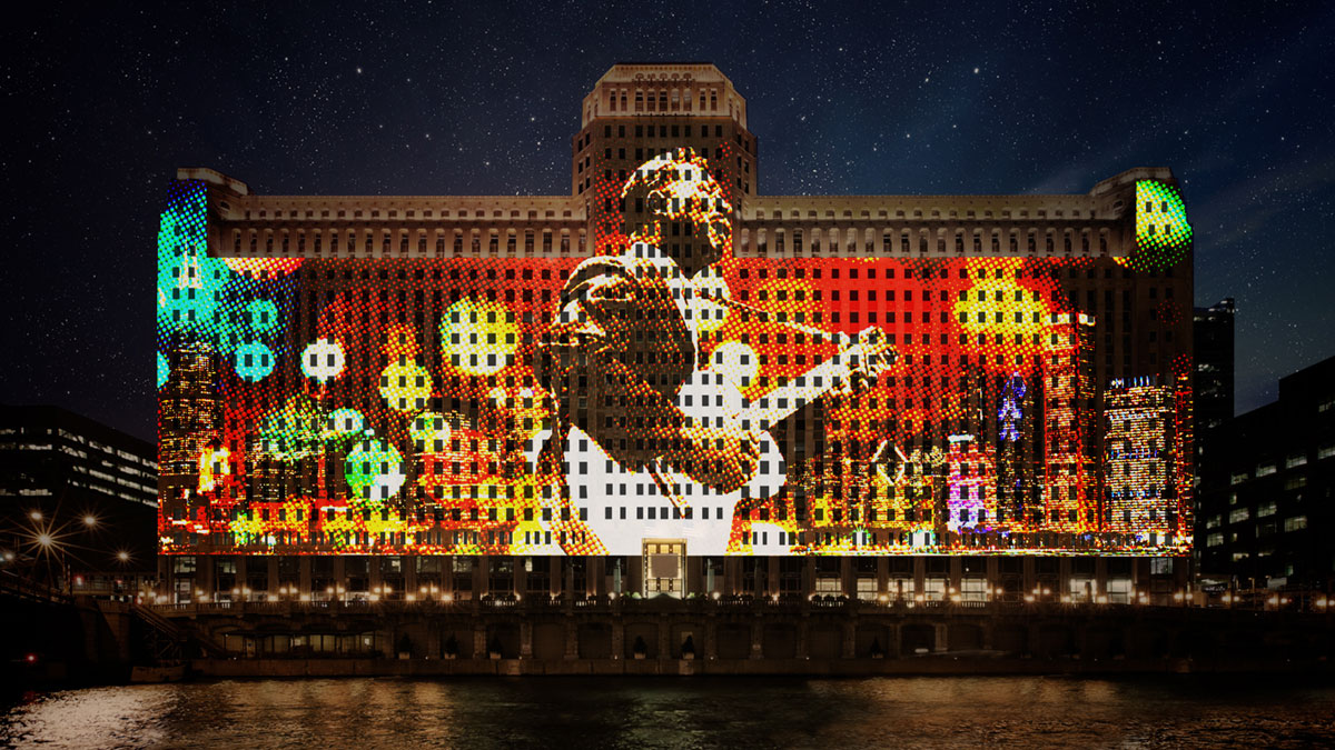 A rendering of blues musician Muddy Waters projected onto the side of the Mart. (Courtesy Obscura Digital)