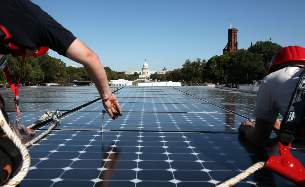 Image of solar panels ahead of U.S. Capitol building