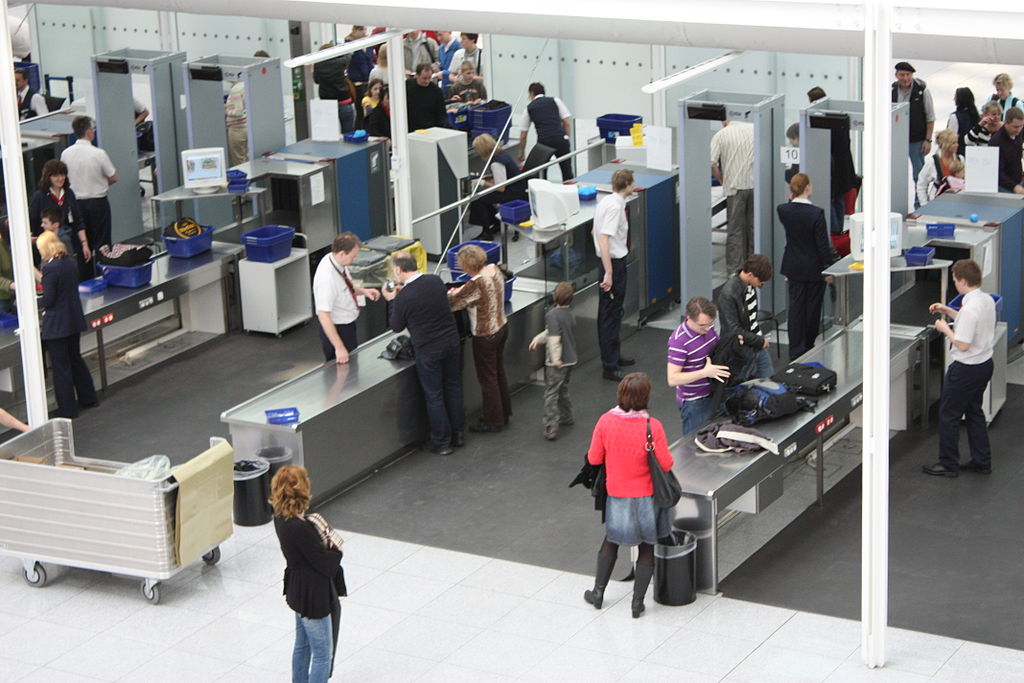 Image of people going through a security checkpoint