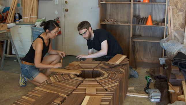 Photo of Kyle and Alyssa Trulen working on their winning design, <i>A Quiet Place to Sit and Rest</i>