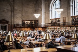 photo of people sitting in the new york public library main reading room
