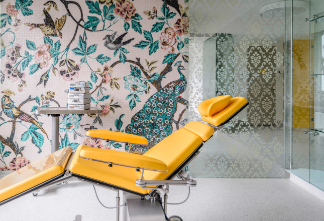 In its design for an expansive dentist's office in Berlin, Karhard Architektur + Design has created a series of bold floral wallpaper prints inspired by native species that fill out a variety of dental surgery and recovery rooms.