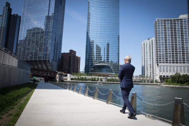 Mayor Rahm Emanuel takes a moment to himself on the Chicago Riverwalk during a visit from the mayor of Hamburg, Germany.