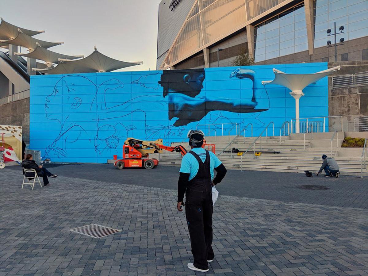 Photo of mural being installed in Atlanta for Off the Wall and the Atlanta Super Bowl HostCommittee