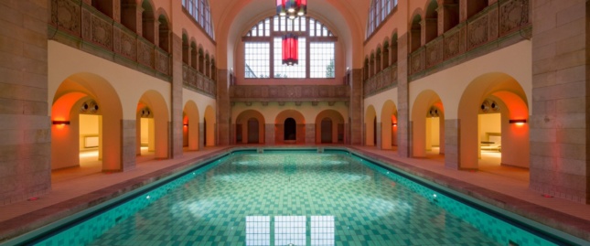The sweeping pool is housed in a centuries-old building.