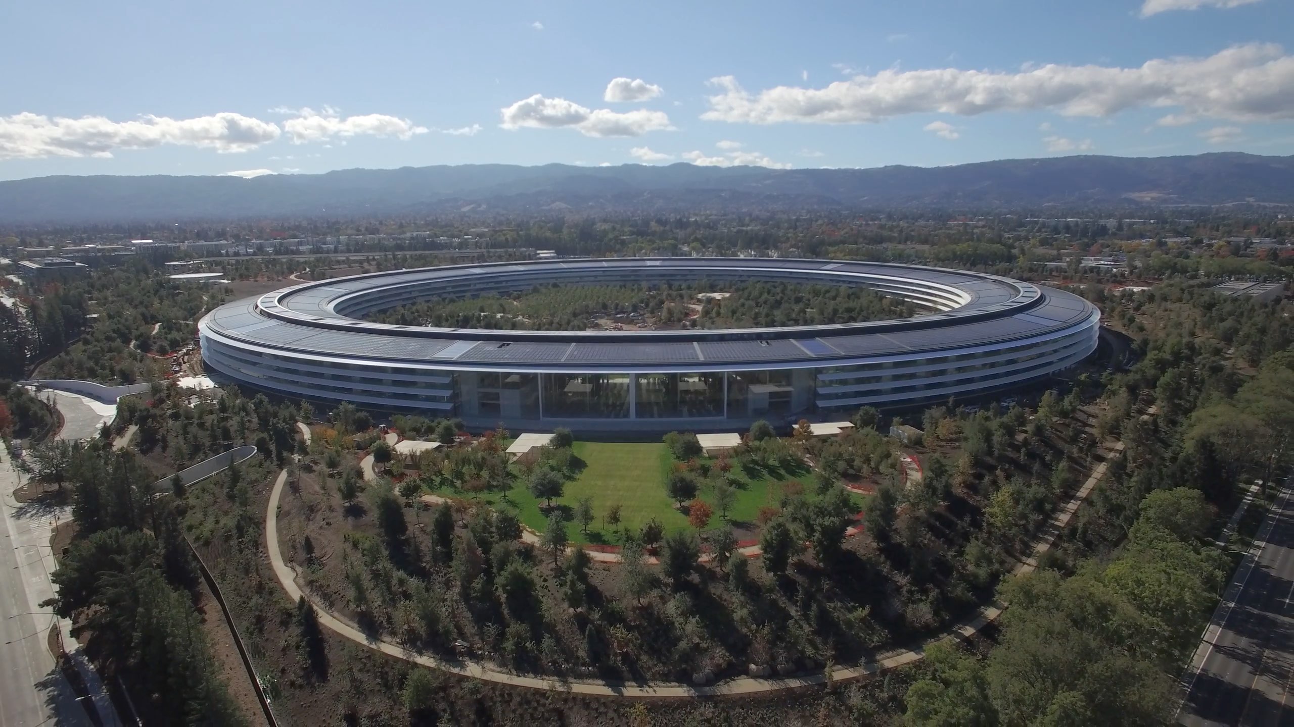 Drone footage of One Apple Park, Apple's Foster + Partners-designed headquarters in Cupertino, California.