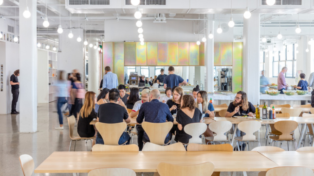 A full-sized cafeteria is set against chromatized steel cabinets.