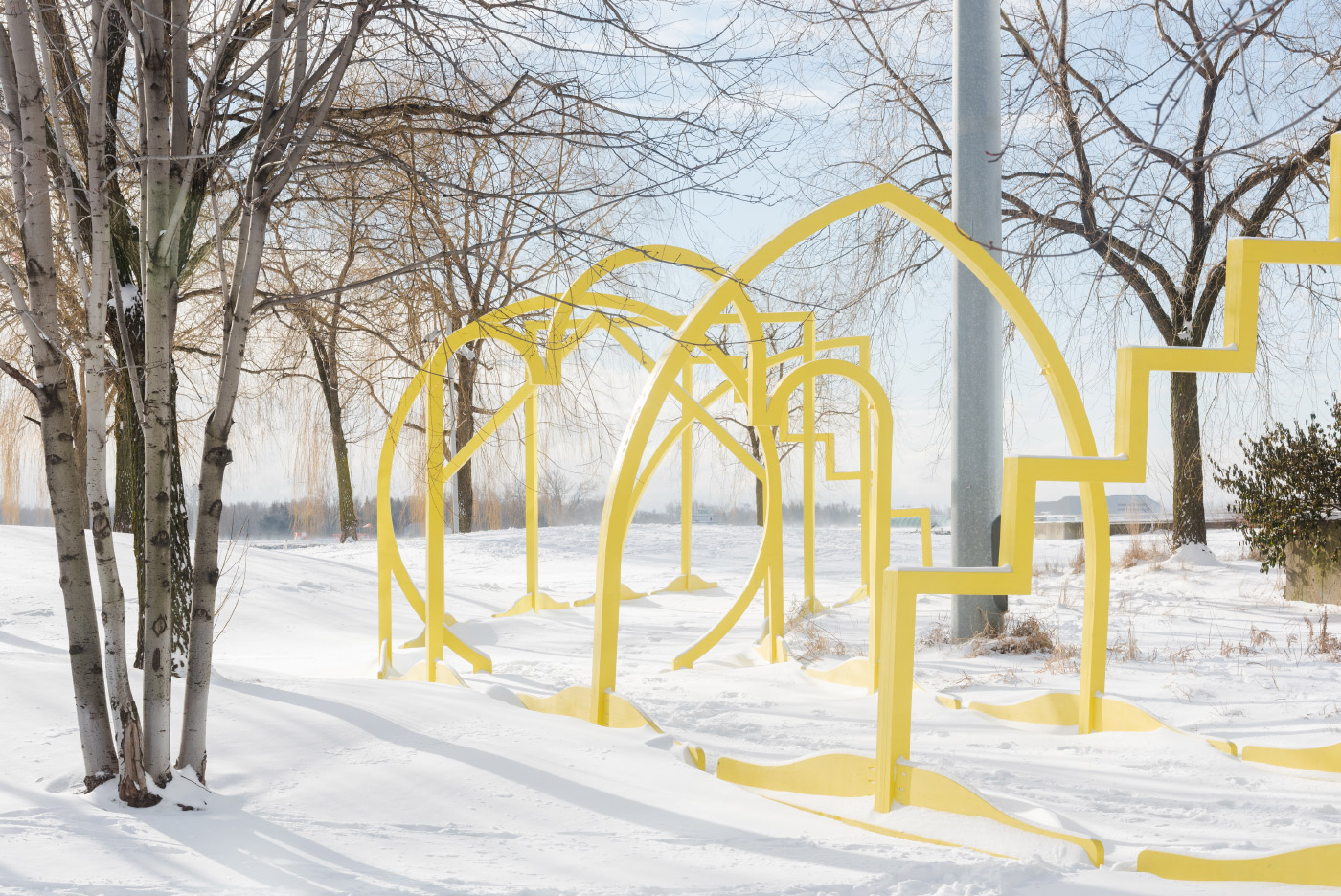Photo of yellow gates in the snow
