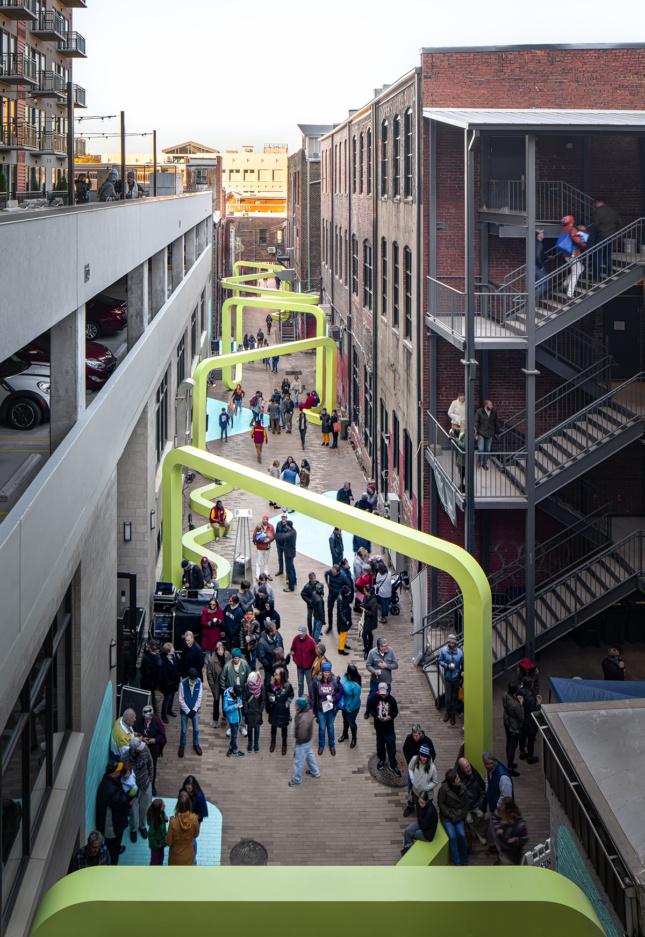 Aerial photo of alley with people interacting with City Thread installation