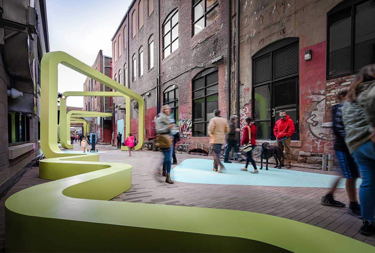 Photo of alleyway with green curvy seating
