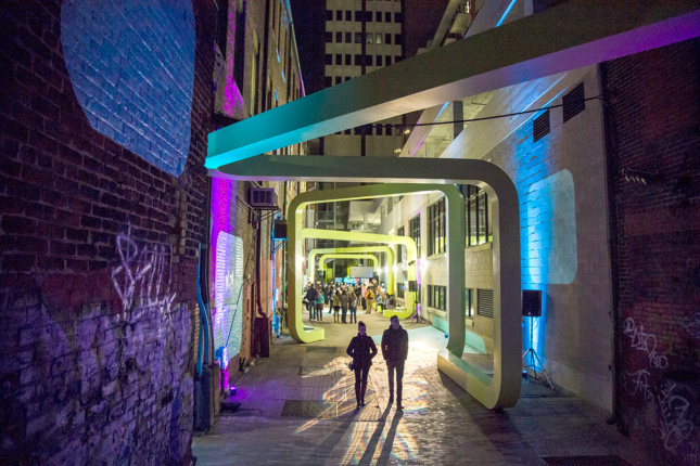Photo of City Thread urban installation lit up at night 