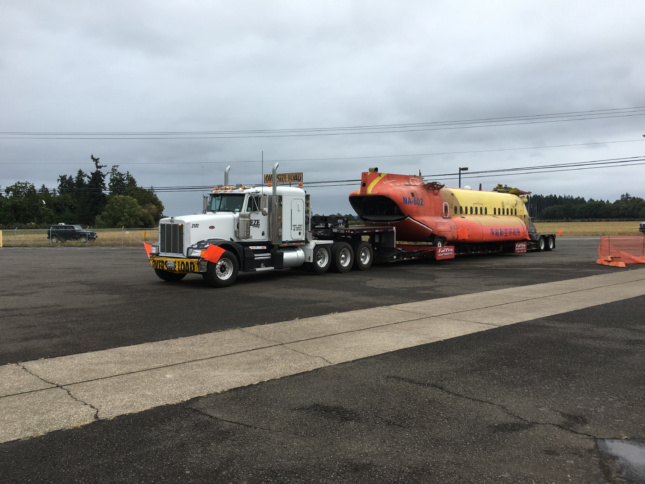 A helicopter on a flatbed truck