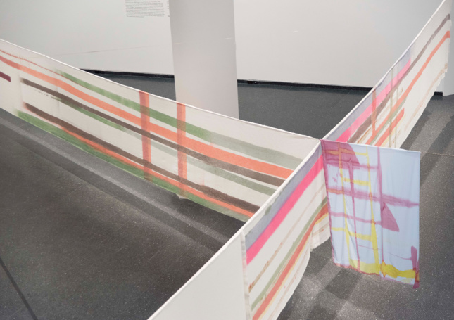 Photo of textile artworks stretched in the Brooklyn Museum