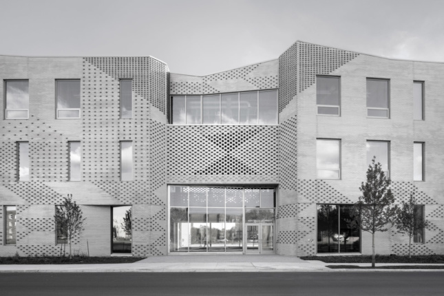 Black and white photo of a brick school facade