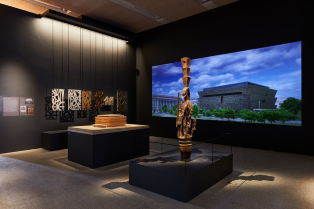 Photo of exhibition at the Design Museum showcasing Adjaye's Smithsonian National Museum of African American History and Culture