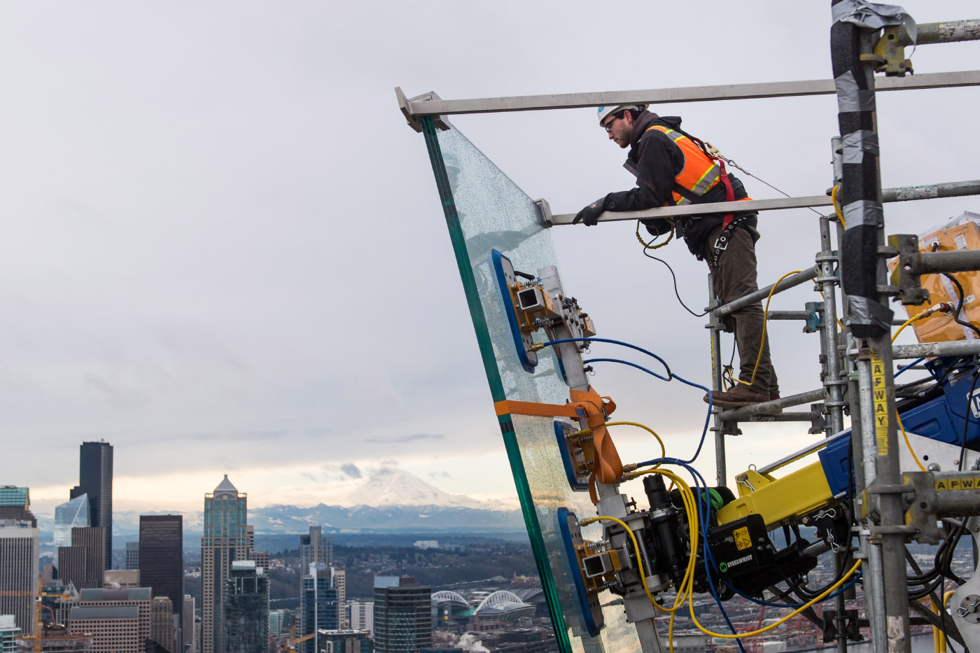 Photo of a construction worker and glass panel