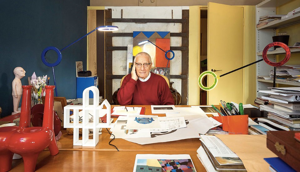 Photo of Alessandro Mendini at his work desk