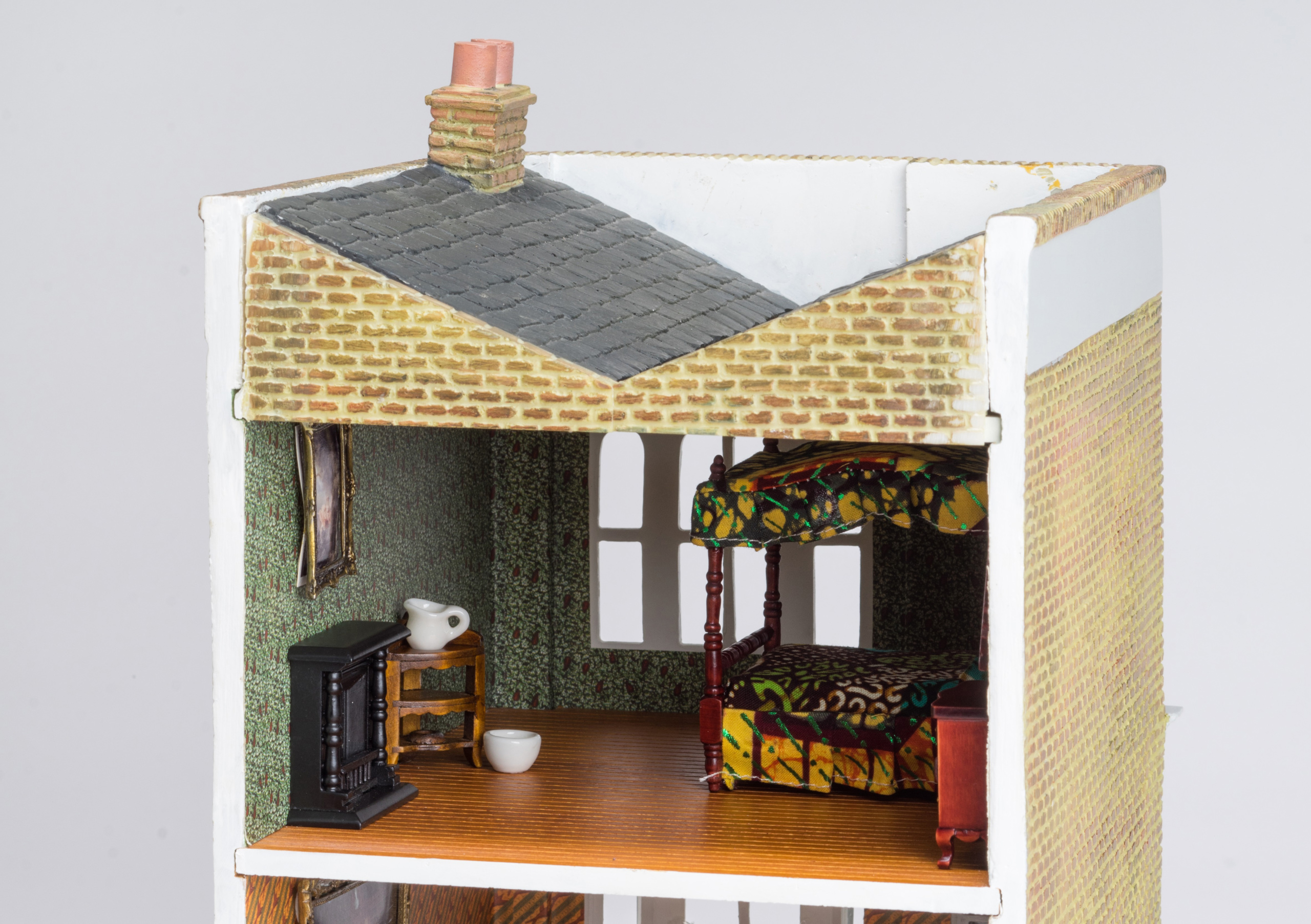 Photo of a dollhouse with traditional African textile patterns