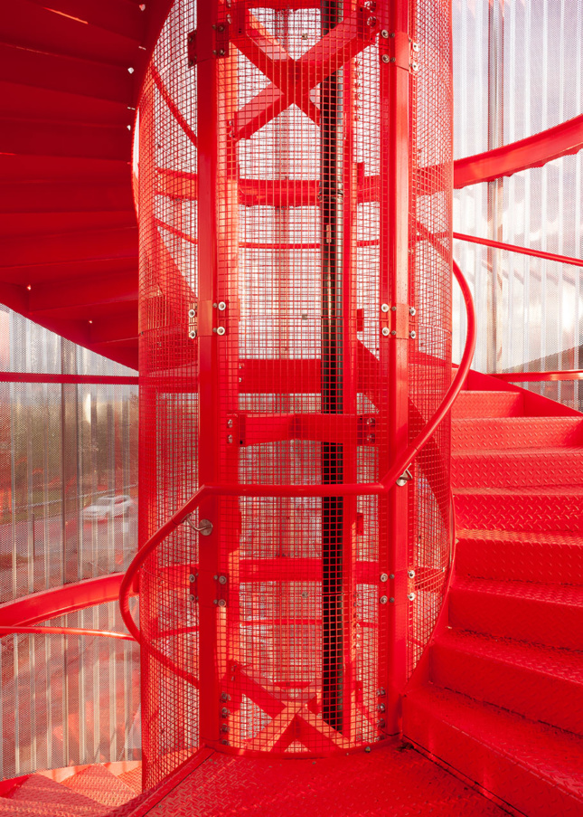 Photo of bright red fire escape spiral staircase