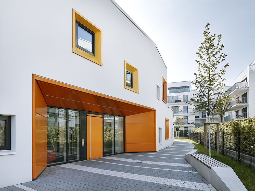 This kindergarten by 1100 Architect features a high-performance insulated facade