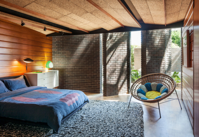 A living room with brick walls