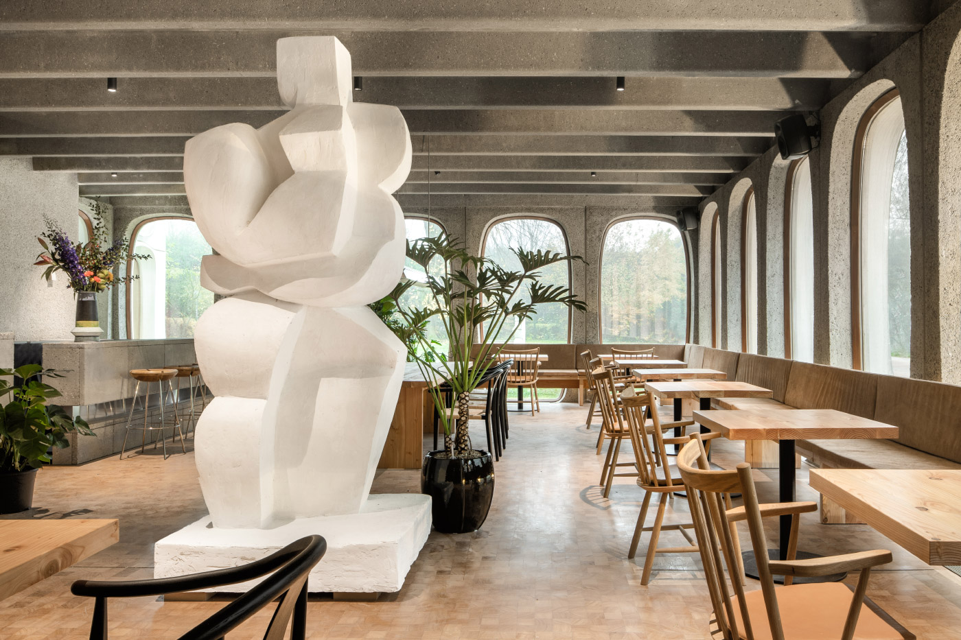 A white statue in a cafe area