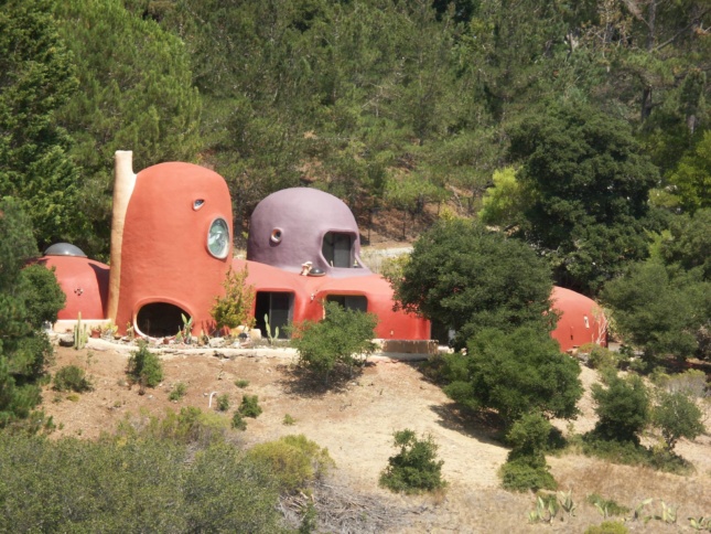 A blobby orange home in the hills, the flintstone house