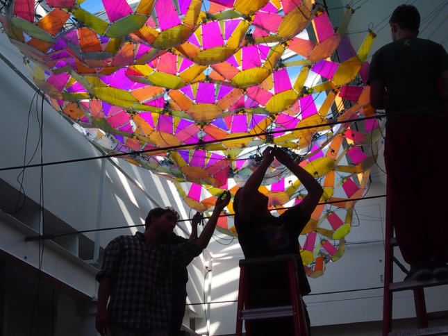 Rendering of a multi-colored plastic canopy under installation