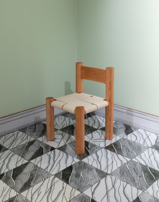 Photo of a simple wooden chair on a tile floor