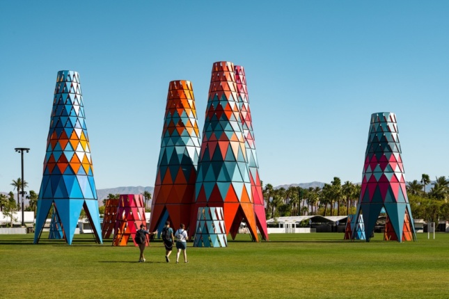 Photo of colored conical towers in a grassy field