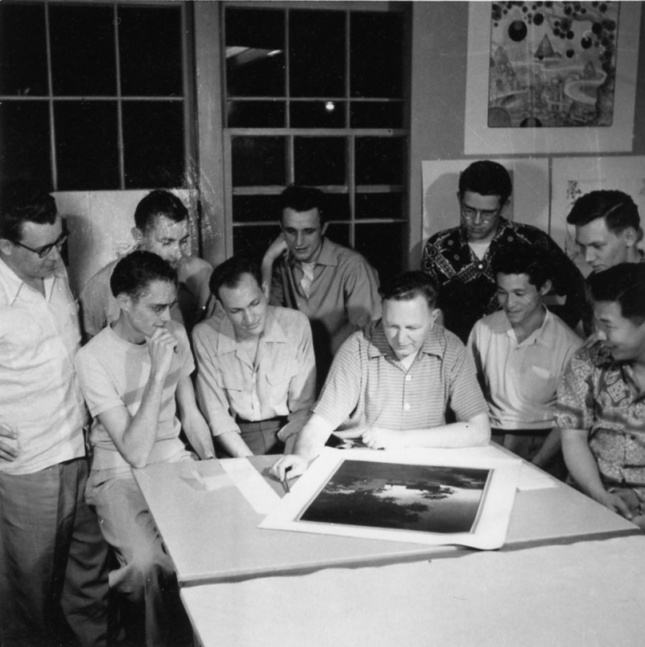 Black and white photo of Bruce Goff with his architecture students
