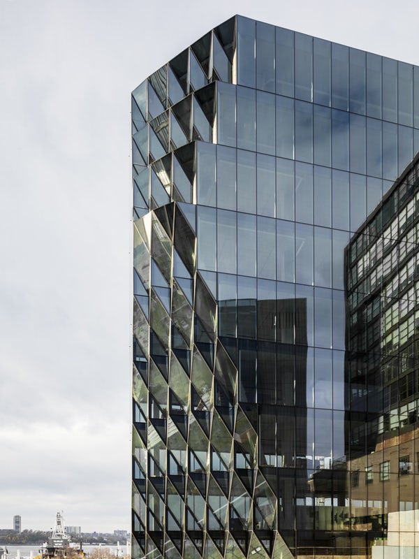 Photo of a glass facade with a diagrid that narrows towards the base