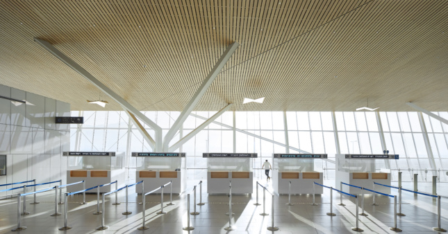 Photo of an airport terminal interior with a bamboo ceiling