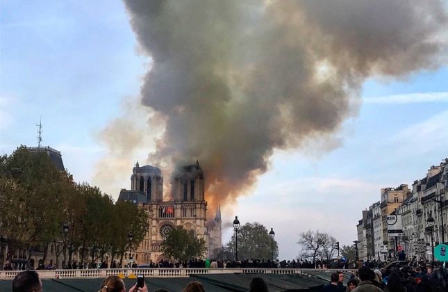 Photo of Notre Dame Cathedral on fire from a distance