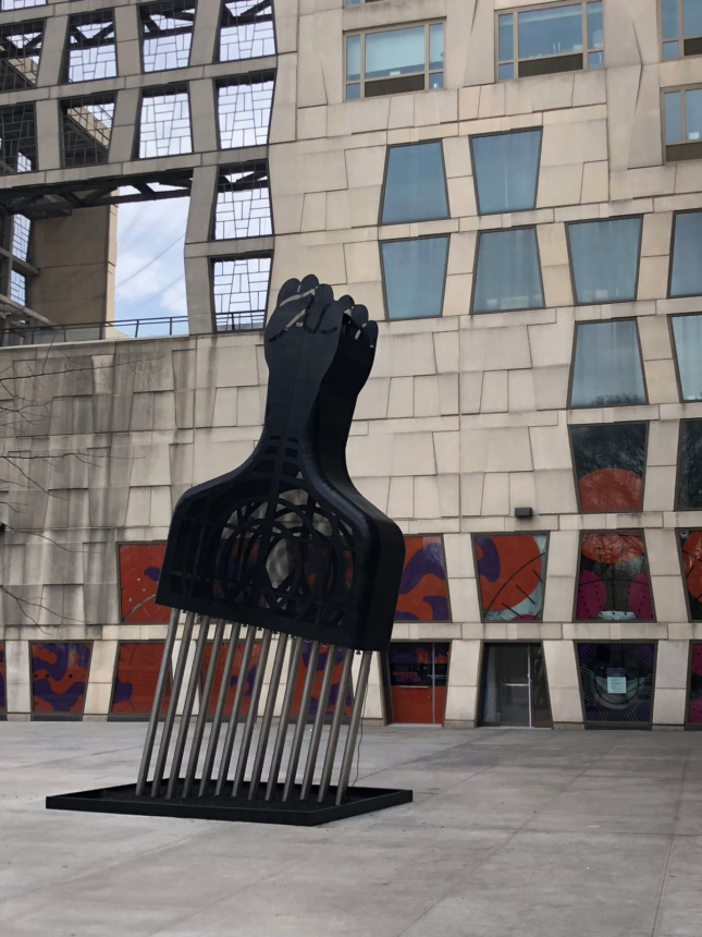 Photo of sculpture of large-scale Afro Pick 