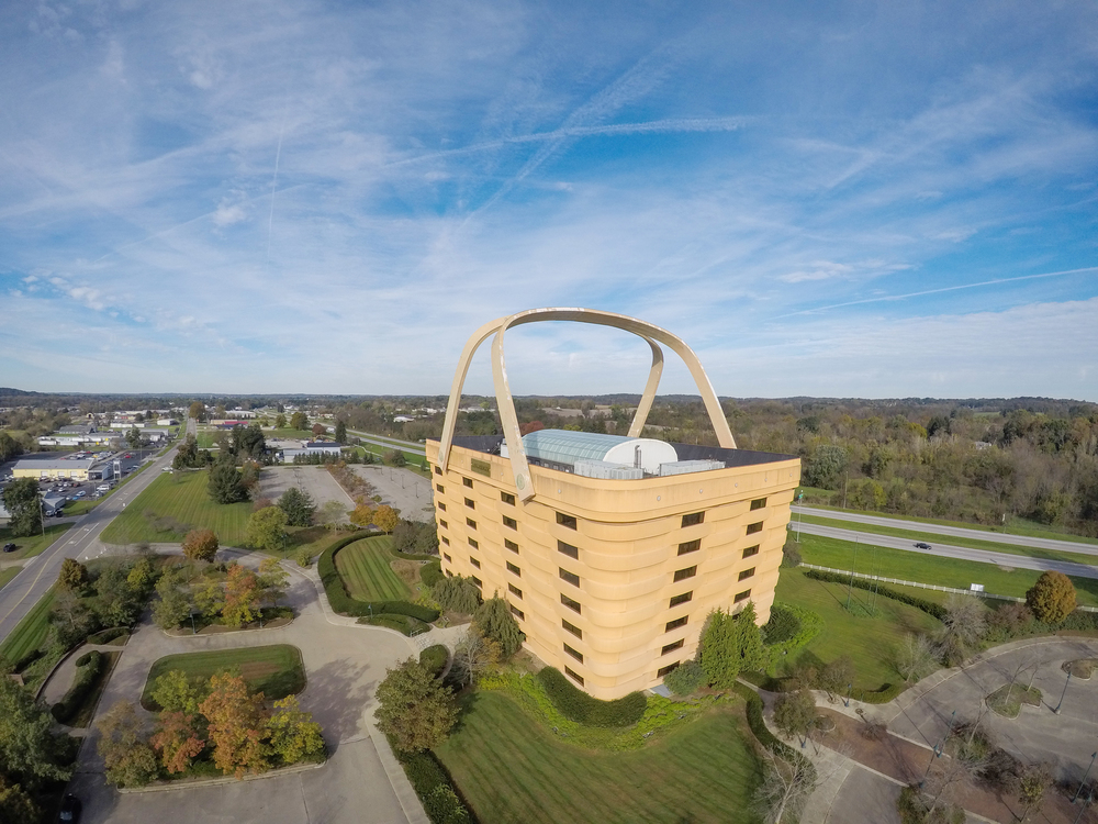 Photo of a large, basket-shaped building from above