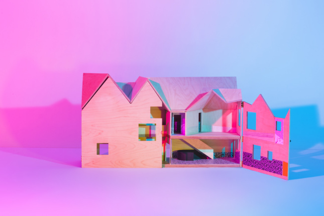 Image of colorful model of house with gabled roof