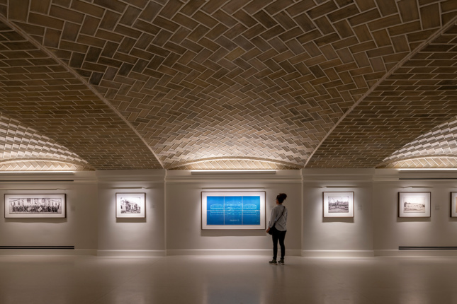 Photo of a gallery space with brick vaulted ceiling