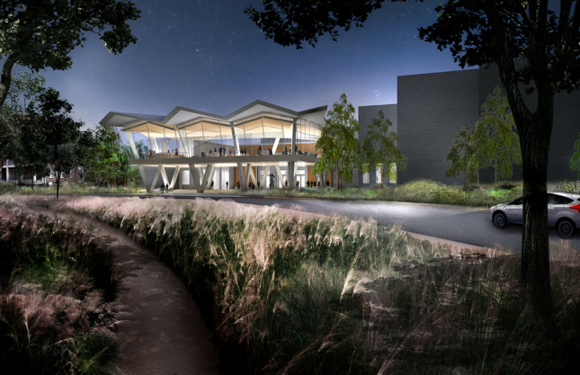 Nighttime rendering of landscape leading up to transparent museum