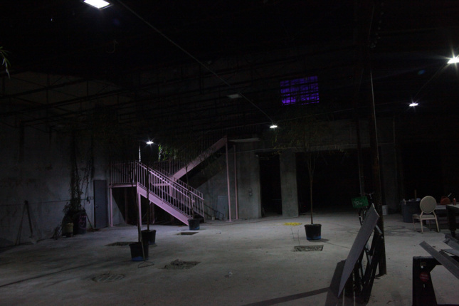 Photo of a dark room with purple stairs