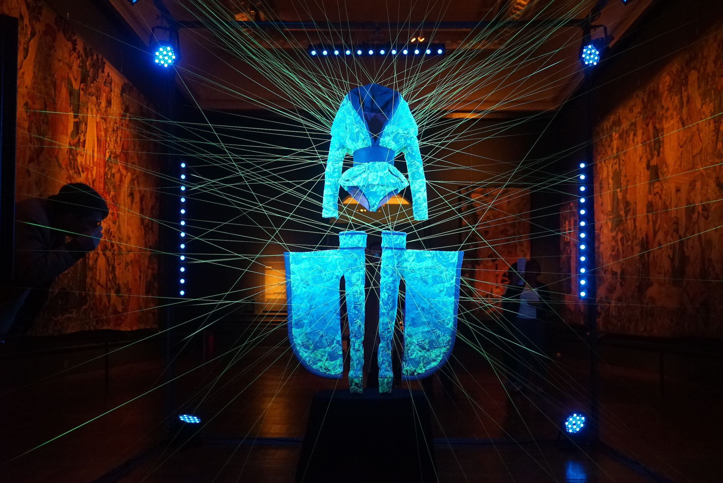 Photo of a suspended glowing silk outfit